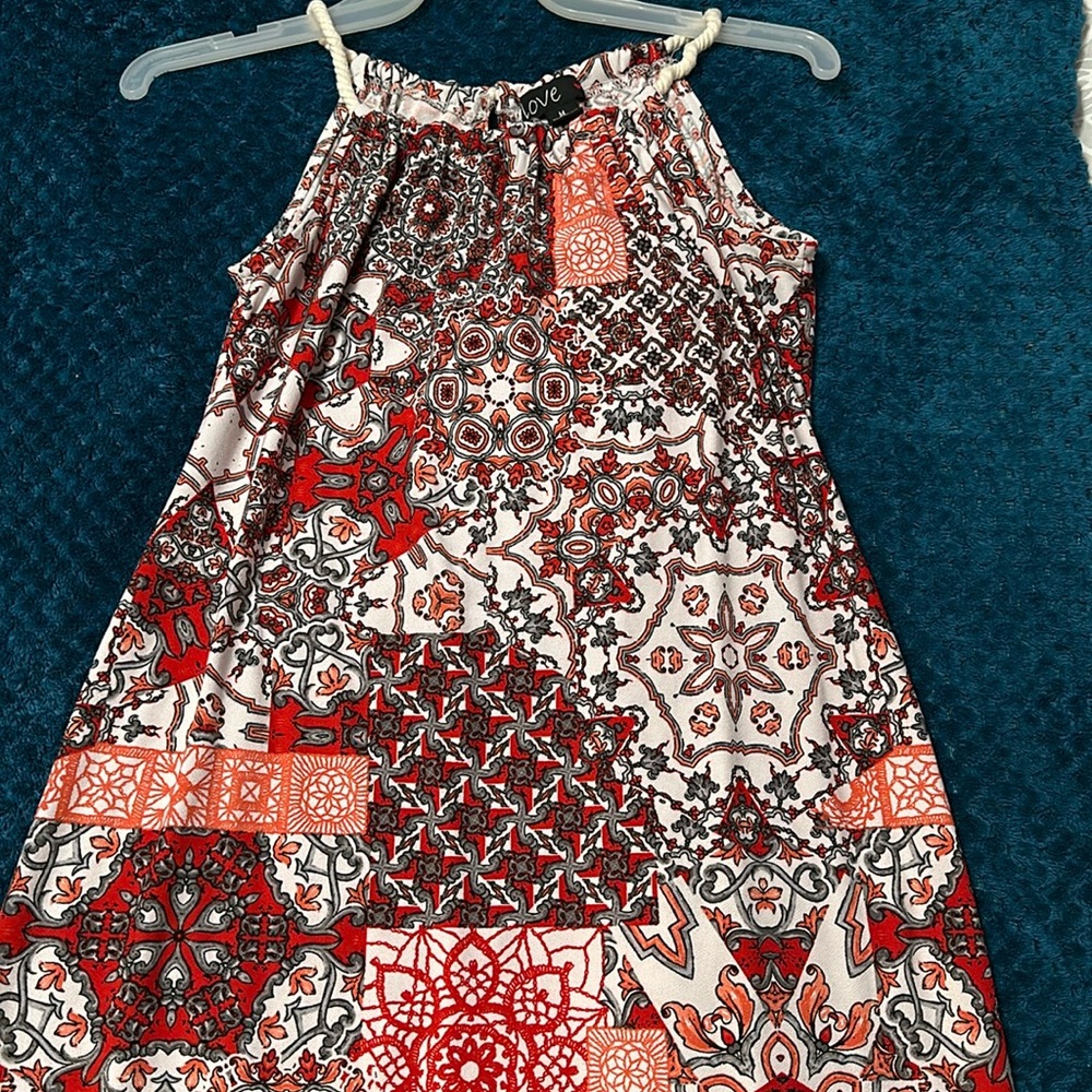 Medium multi-colored dress from Love, with a spiral strap. Perfect for summer!